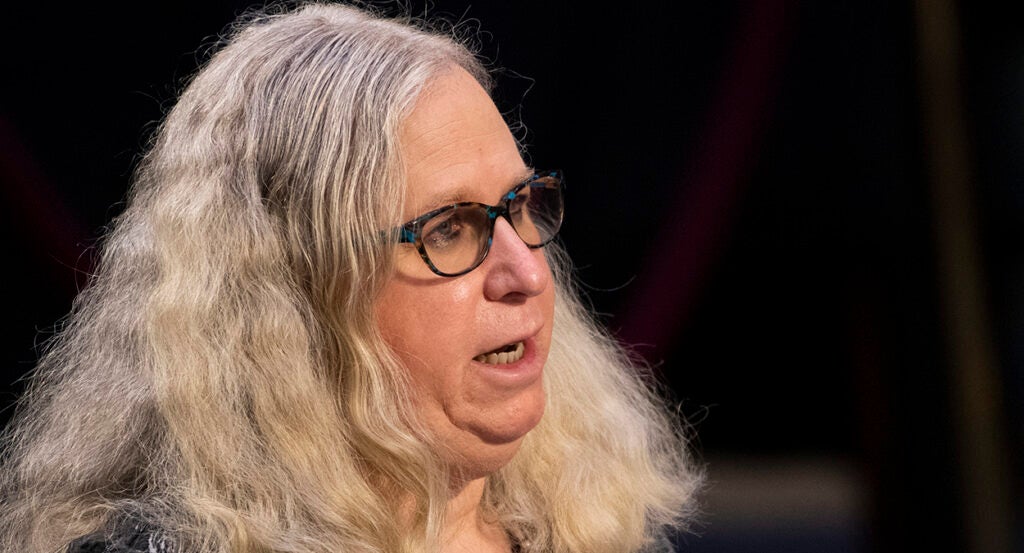 Rachel Levine with a double chin speaks in a confirmation hearing with long blond hair