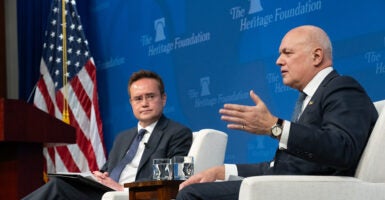 Neal Gardiner sits with Sir Iain Duncan Smith