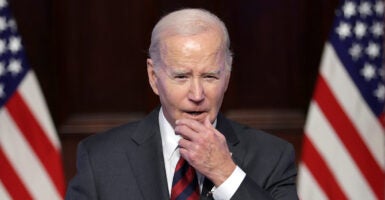 President Biden Delivers Remarks, putting his hand up to his chin