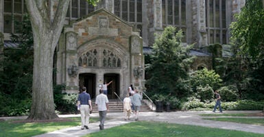 students walk in to and from to a building at the university of michigan