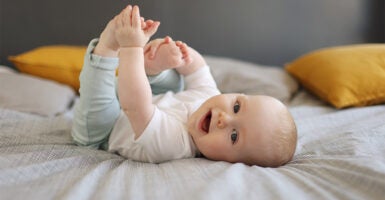 Baby smiling at home.