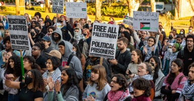 Massachusetts Institute of Technology students hold pro-Palestine posters at a protest