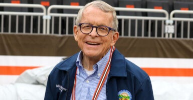 Ohio Gov. Mike DeWine in a blue shirt and coat