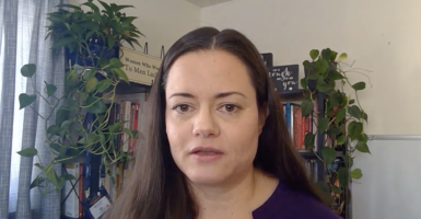 Nicole Marie Prussman in front of books