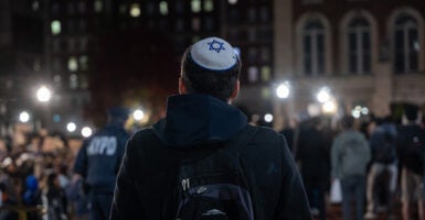 a student stands in a crowd