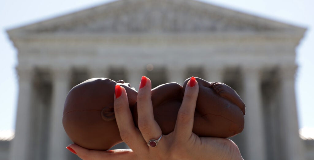 Republican Florida Sen. Marco Rubio has a plan for a Republican party struggling to message on abortion post Roe v. Wade. Pictured: a pro-life activist holds a model fetus during a demonstration in front of the U.S. Supreme Court June 29, 2020 in Washington, DC. (Photo by Alex Wong/Getty Images)