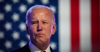 President Joe Biden With large American flag in background