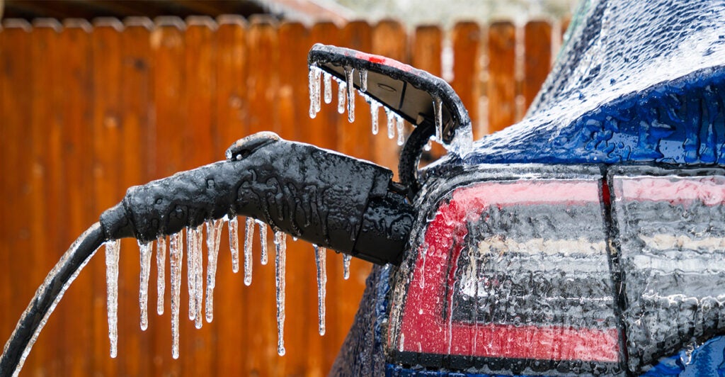 icicles form on electric car and it's plugged in the charger cord