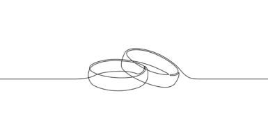 A sketch of two wedding bands is seen on a white paper.