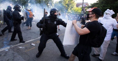 Police officers clash with protesters near the White House on June 1, 2020 as demonstrations against George Floyd's death continue.