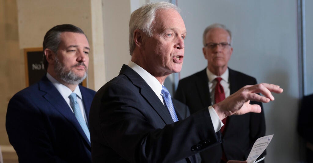 Sen. Ron Johnson speaks during a press conference on Capitol Hill with Se. Ted Cruz next to him