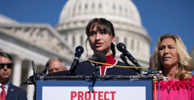 Chloe Cole speaks as Rep. Marjorie Taylor Greene (R-GA) looks on during a news conference on Capitol Hill September 20, 2022 in Washington, DC. (Photo by Drew Angerer/Getty Images)