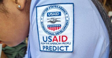 The USAID logo on the shoulder of a midwife uniform