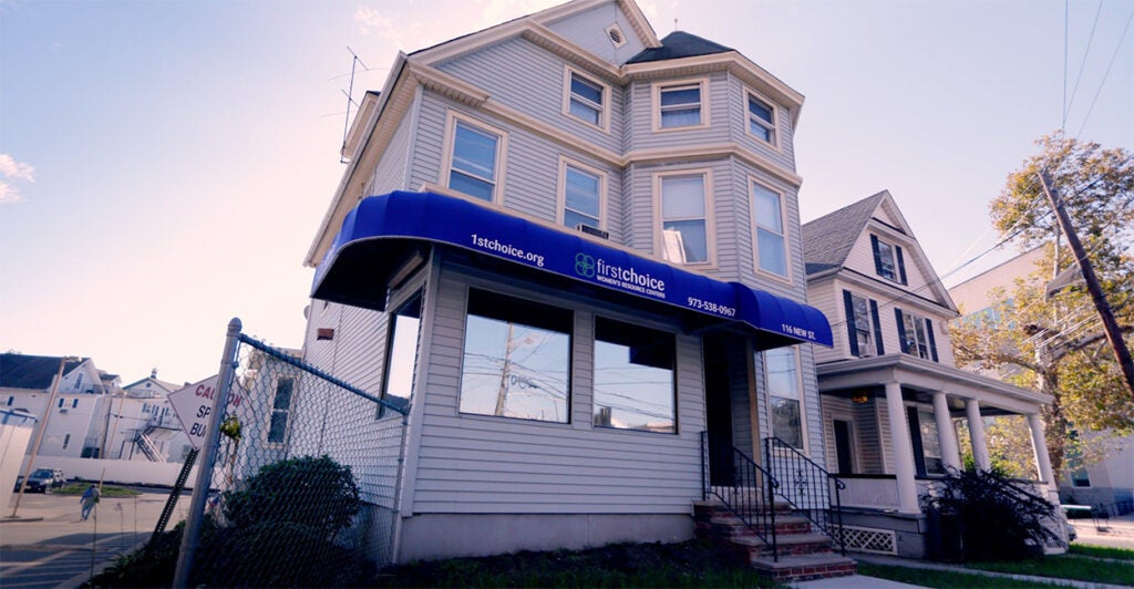 A building with "first choice" on it's banner.