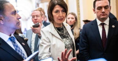 A small group of members of Congress, including Rep. Cathy McMorris Rodgers, talk to press.