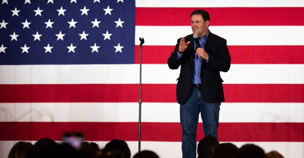 The head of the Arizona Freedom Caucus condemned the "calculated political decision making" exhibited by Arizona Republicans who sought to distance themselves from the state's most massive pro-life victory yet. Pictured: Arizona governor Doug Ducey expresses support for republican gubernatorial candidate Tudor Dixon. (Photo: Emily Elconin for The Washington Post via Getty Images)