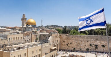 A Israeli flag is see flying over the Wailing Wall in Jerusalem.