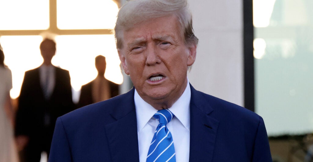 Donald Trump in a blue suit with a blue tie