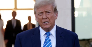 Donald Trump in a blue suit with a blue tie