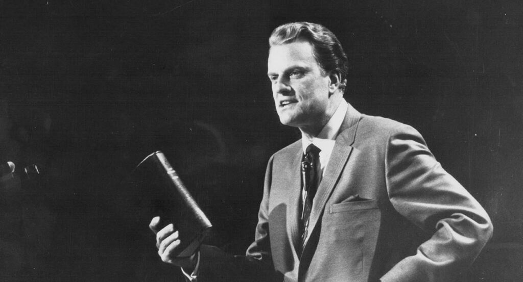 The Rev. Billy Graham holds a Bible in an undated file photo circa 1970.