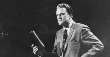 The Rev. Billy Graham holds a Bible in an undated file photo circa 1970.