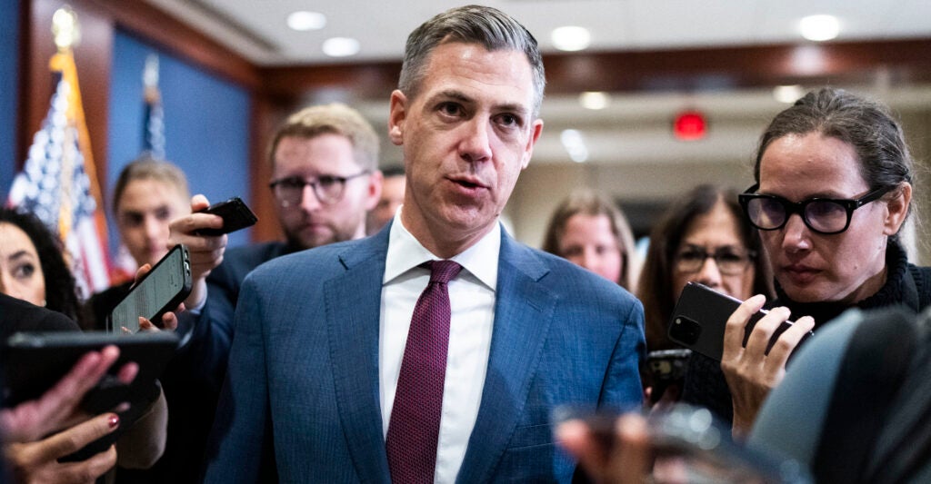 Rep. Jim Banks in a blue suit and purple tie