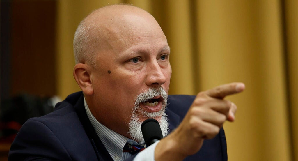 Chip Roy in a suit with a white goatee