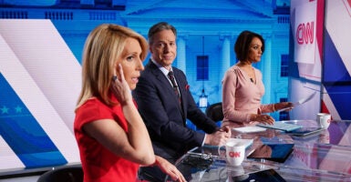 Jake Tapper, Dana Bash, and Ilia Calderon at a CNN desk