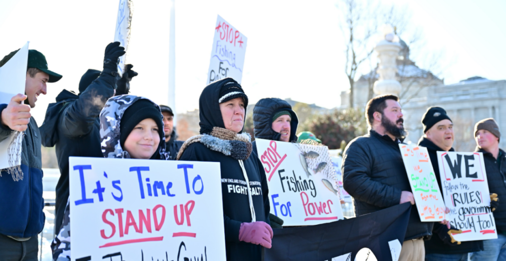 Fishermen and their families protest at the Supreme Court