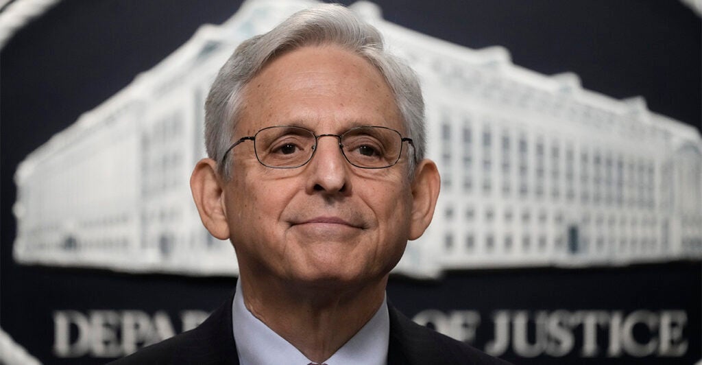 Attorney General Merrick Garland With the Department of Justice logo in the background