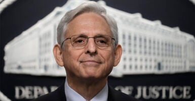 Attorney General Merrick Garland With the Department of Justice logo in the background