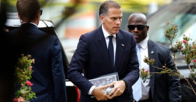 Hunter Biden stands in a suit