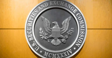 U.S. securities and exchange gray metal seal On a wooden wall