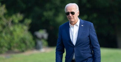 Joe Biden in a suit and sunglasses