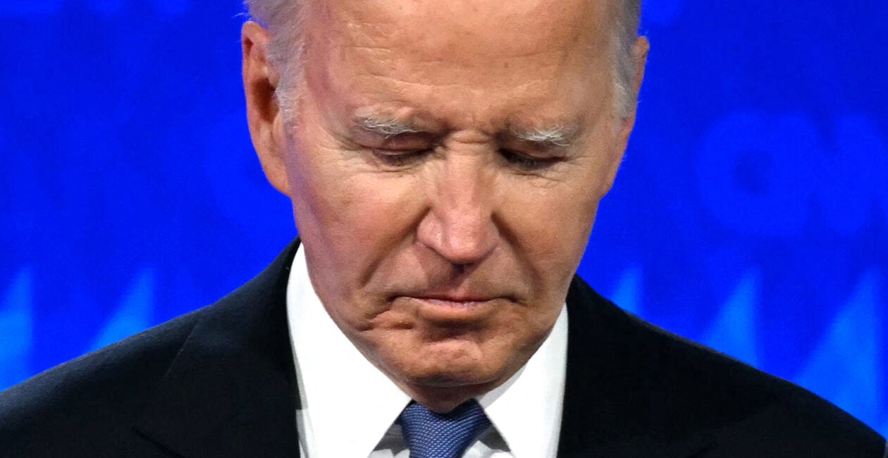 TOPSHOT - US President Joe Biden looks down as he participates in the first presidential debate of the 2024 elections with former US President and Republican presidential candidate Donald Trump at CNN's studios in Atlanta, Georgia, on June 27, 2024. (Photo by Andrew CABALLERO-REYNOLDS / AFP) (Photo by ANDREW CABALLERO-REYNOLDS/AFP via Getty Images)