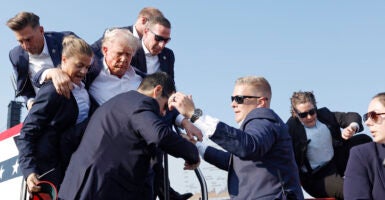 Republican presidential candidate former President Donald Trump is rushed offstage during a rally on July 13, 2024 in Butler, Pennsylvania. (Photo: Anna Moneymaker/Getty Images)