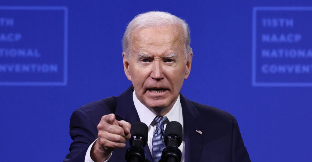 Joe Biden speaking behind a podium.