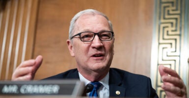 Senator Kevin Cramer speaking behind a desk.