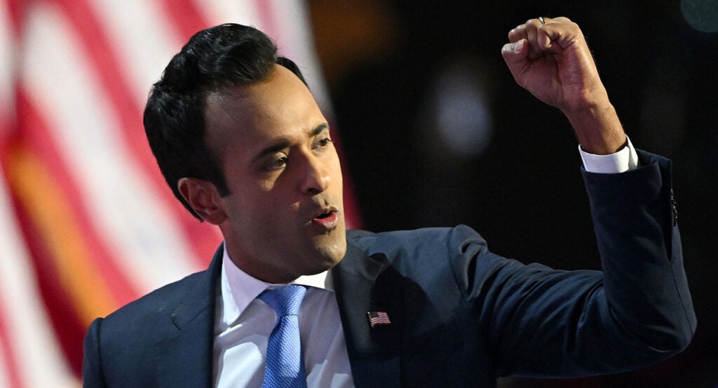 Vivek Ramaswamy in a suit with an American flag pin