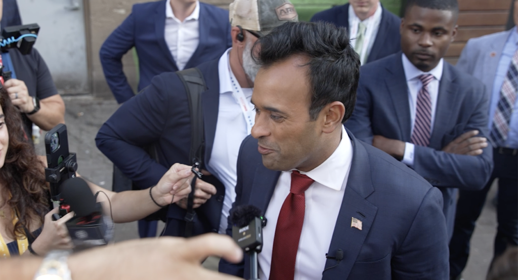 Vivek Ramaswamy in a blue suit with a red tie