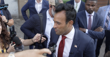 Vivek Ramaswamy in a blue suit with a red tie