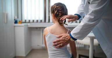 A little girl in the doctor's office