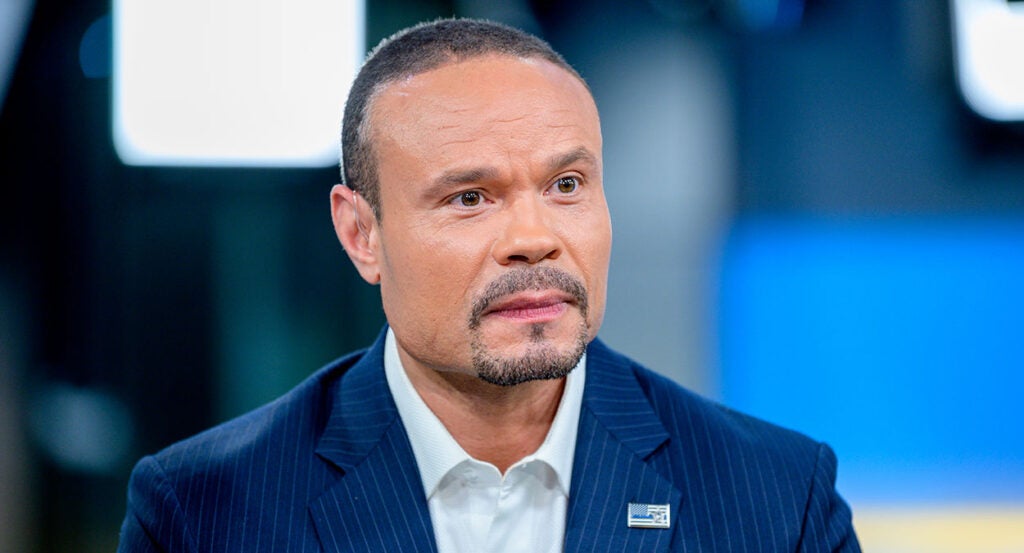 Dan Bongino in a blue pin-stripe sport coat