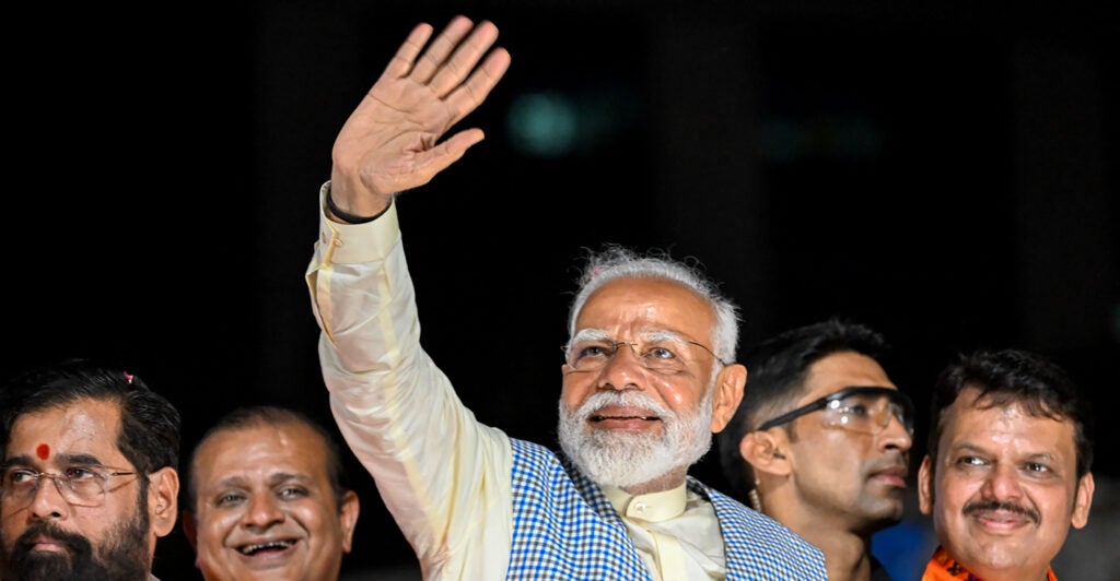 India’s Prime Minister Narendra Modi waves to a crowd.