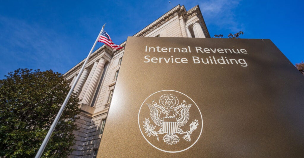 Looking upward At the IRS building in Washington DC from Its front sign