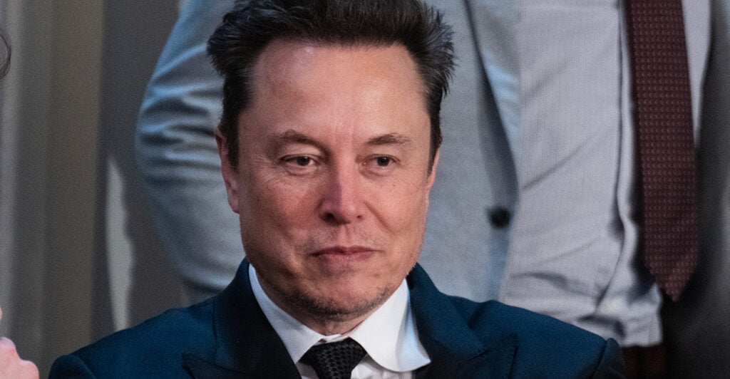 Elon Musk in a suit