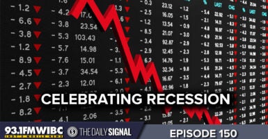 A downward trend graph with the words "celebrating recession"