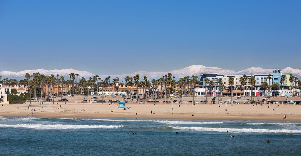 A California beach with mountains in the background.