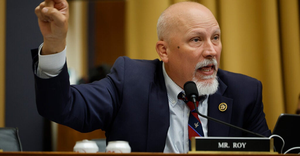 Chip Roy talks while wearing a suit