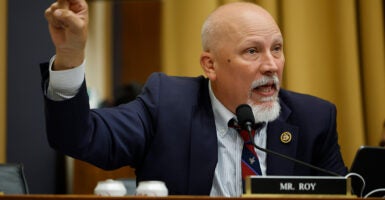 Chip Roy talks while wearing a suit